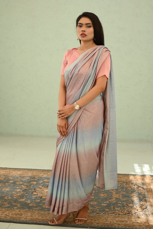 Woman wearing a Silk saree with a light background